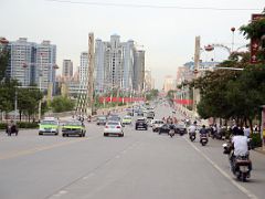 16 Kashgar Wide Street With Modern Buildings And Ferris Wheel